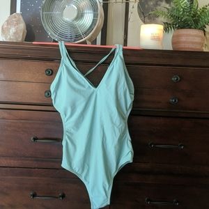 Aqua blue swim suit with cut outs